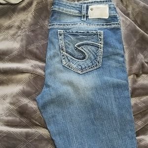 Silver jeans with destressing